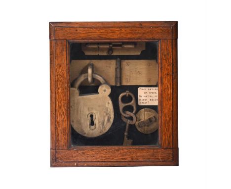 SURREALIST SCHOOL (20TH CENTURY) LOCK DISPLAY CABINET  Wood model in glazed wooden cabinet  Inscribed to label 'Made entirely