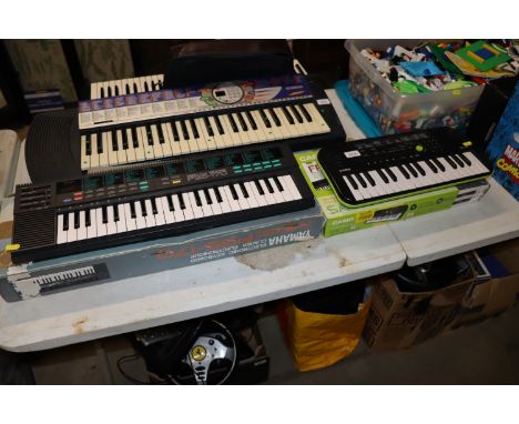 A Casio SA-46 keyboard and a Yamaha PSS-170 keyboard