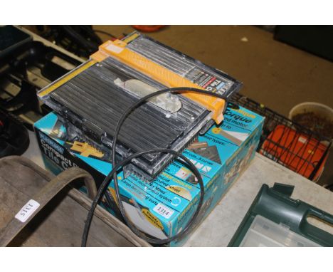 A Plasplugs Compact Plus tile cutter in original box