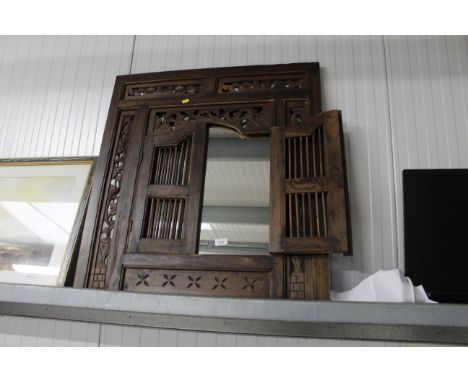 A rustic style mirror enclosed by a pair of spindle panel doors