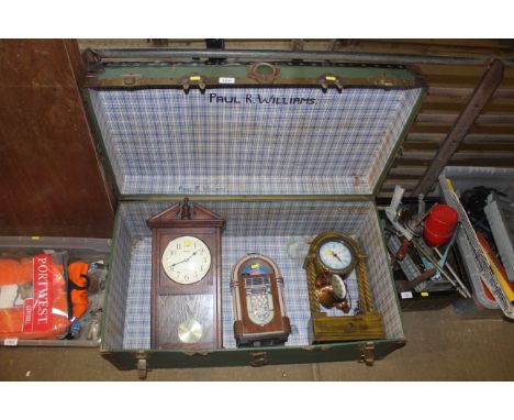 A traveling chest containing a wall clock, mantel clock, alarm clock etc