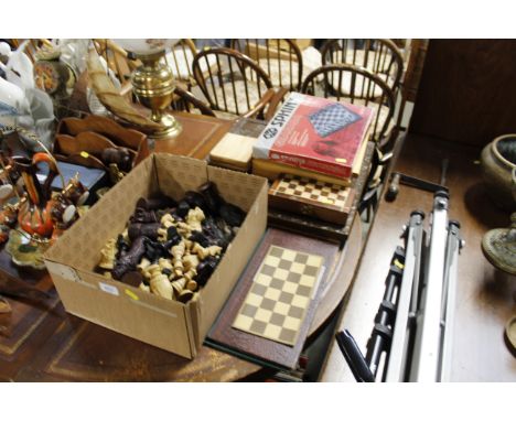 A collection of various chess pieces, chess boards etc.