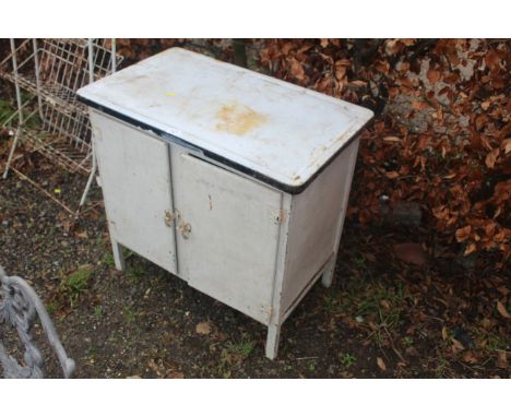 A vintage enamelled topped kitchen cupboard