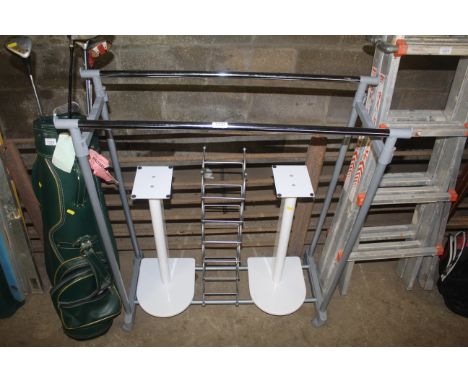 A lightweight dual rail clothes rail, two speaker stands and a metal wine rack