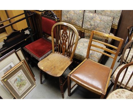 An elm seated stick and wheel back dining chair and a 1930's oak ladder back dining chair together with a Victorian carved oa