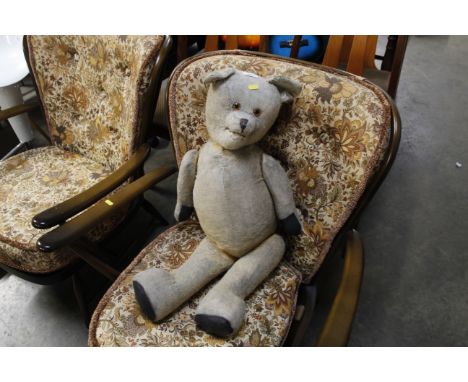 A vintage teddy bear in need of attention