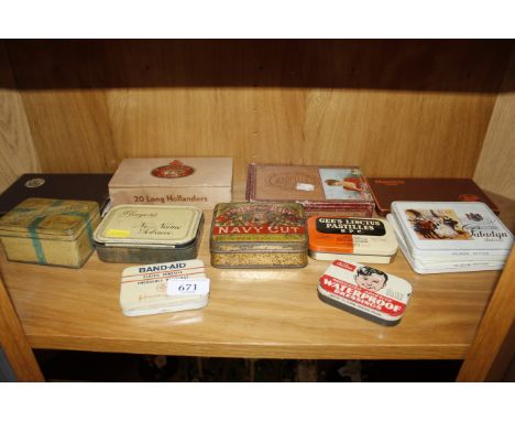 A collection of various vintage tobacco and other tins and boxes