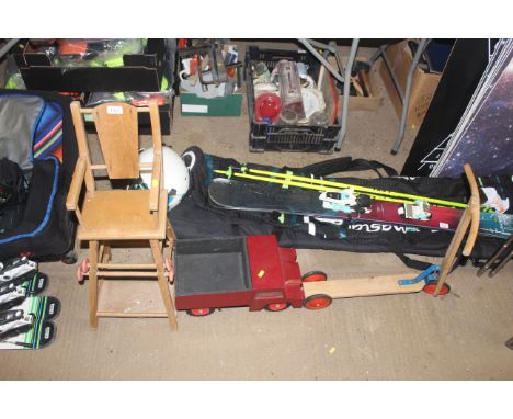 A child's dolls metamorphic high chair, wooden scooter, and toy car