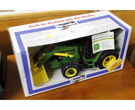 A John Deere 6400 tractor in box