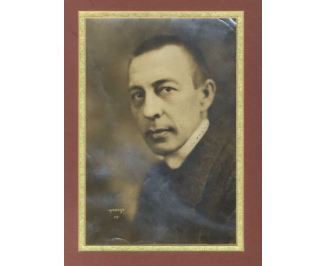  RACHMANINOFF SERGEI: (1873-1943) Russian Composer and Pianist. Vintage signed sepia 6.5 x 9.5 photograph of Rachmaninoff in 