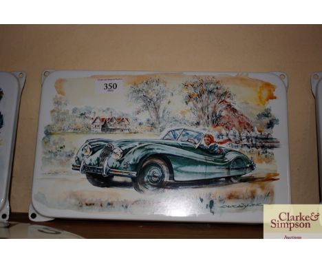 An enamel replica sign depicting a Jaguar XK120