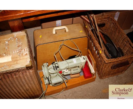 A Singer sewing machine - sold as a collectors item with accessories 