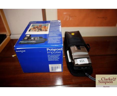 A Nikon Nuvis 160i camera; and a Polaroid Impulse camera