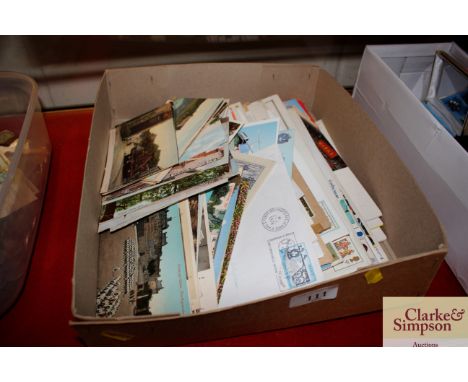 A box of various post-cards and First Day covers 