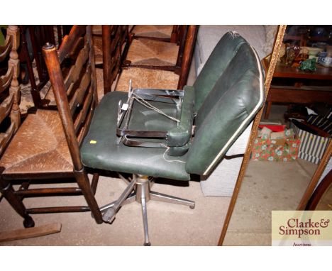 A vintage leather and chrome barbers chair
