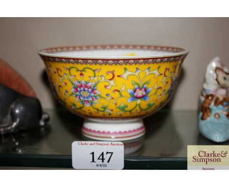 A Chinese yellow enamel decorated bowl with printed six character mark to base