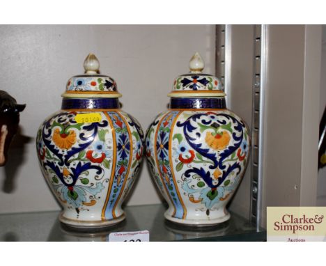 A pair of Noritake porcelain baluster vases and covers 