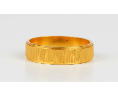 A 22ct gold wedding ring with a textured finish, London 1972, weight 4.2g, ring size approx M.Buyer’s Premium 29.4% (includin