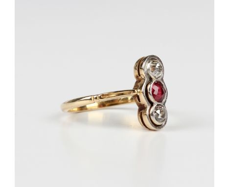 A gold, diamond and red spinel ring, mounted with a cushion cut red spinel between two cushion cut diamonds, detailed '18ct',