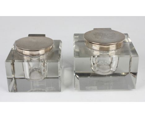 A George V silver mounted square cut glass inkwell, the hinged lid crest engraved, London 1913 by John Collard Vickery, heigh