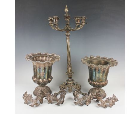 A pair of 19th century plated wine coolers, each of urn form with wavy naturalistic outswept rim above a lobed body flanked b