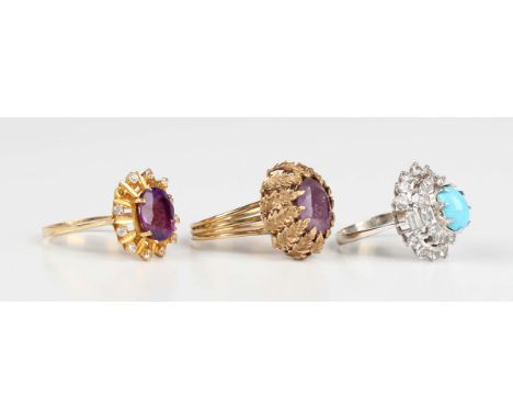 A gold and amethyst single stone ring, mounted with an oval cut amethyst within a foliate surround, unmarked, weight 5.9g, ri