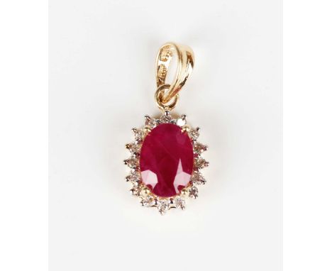 A gold, ruby and diamond oval cluster pendant, claw set with the oval cut ruby within a surround of circular cut diamonds, de