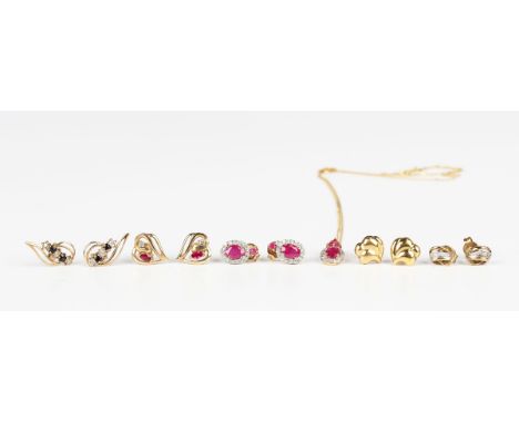 A 9ct gold, ruby and diamond oval cluster pendant, length 1.3cm, with a gold neckchain on a boltring clasp, detailed '375', l