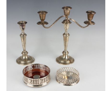 An Elizabeth II silver and turned wood millennium wine coaster, the sides pierced with a continuous band of '2000', Birmingha