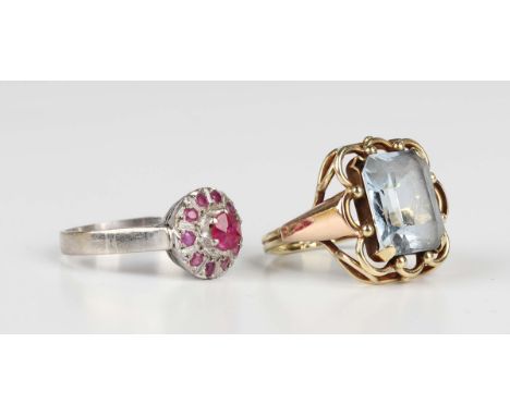 A gold ring, claw set with a rectangular cut synthetic blue spinel, detailed '585', weight 5.1g, ring size approx K, and a wh