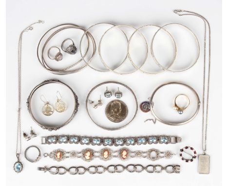 A group of mostly silver jewellery, comprising a set of four bangles, inside width 6.5cm, a triple bangle, three further bang