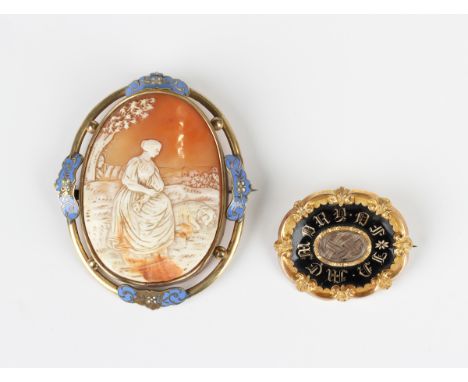 A Victorian black enamelled shaped oval mourning brooch, mid-19th century, glazed with a central oval hair locket compartment