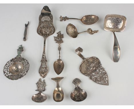 A German silver caddy spoon, cast with figural handle and landscape to bowl, import mark Chester 1909 by Berthold Muller, len