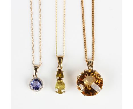 A gold, tanzanite and diamond cluster pendant, mounted with the circular cut tanzanite within a surround of small circular cu