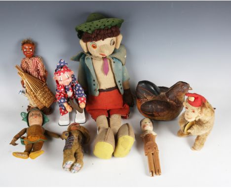 A small collection of mechanical toys and dolls, including a tinplate battery-powered egg-laying chicken, a clockwork monkey 