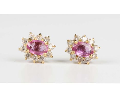 A pair of 18ct gold, pink sapphire and diamond oval cluster earstuds, each claw set with the oval cut pink sapphire within a 