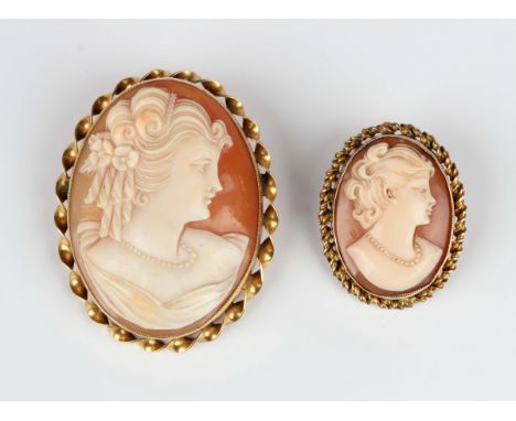 A gold mounted oval shell cameo brooch, carved as a portrait of a lady within a ribbon twist surround, detailed '9ct', width 