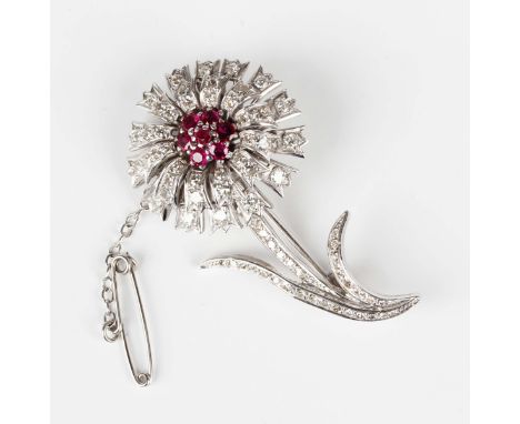 A white gold, ruby and diamond brooch, designed as a floral spray, detailed '18', weight 10.1g, width 4.5cm.Buyer’s Premium 2