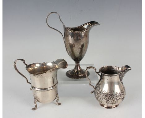 A George III silver helmet cream jug with loop handle and circular foot, London 1788, height 14.1cm, a Victorian silver cream