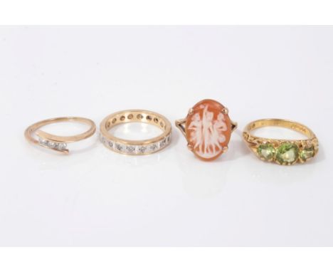 Gold (9ct) cameo ring, size H, gold (9ct) diamond three stone cross over ring, size L, gold (9ct) eternity style ring, size L