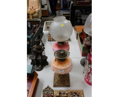  Late Victorian oil lamp, with pink opaline glass reservoir, globular etched glass shade and clear glass chimney, together wi