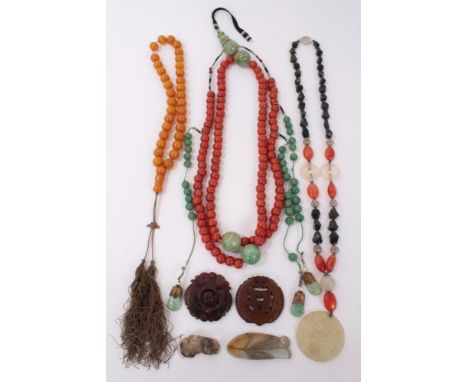 Three old Chinese necklaces two include a coral glass bead and green stone necklace, simulated amber bead necklace, hardstone
