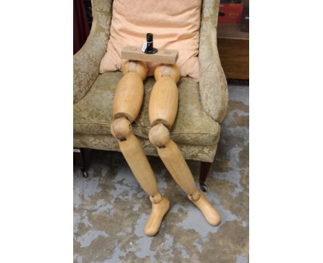 Pair of carved wood articulated mannequin legs, with ball socket joints, total height 107cm