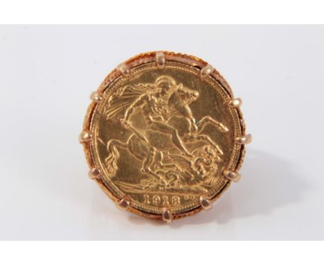 1918 gold full sovereign in 9ct gold ring mountCondition report: Total weight 15g