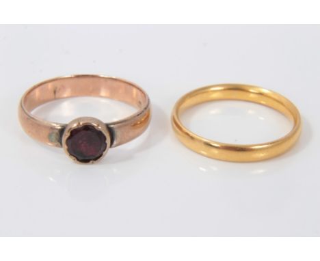 22ct gold wedding ring and an antique rose gold ring set with as single garnet (2)Condition report: 22ct ring weighs 3.1g, th