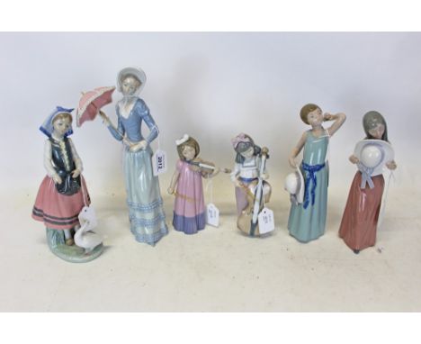 Four Lladro porcelain figures, women holding an umbrella, young girl feeding a goose, two girls holding there hats together w
