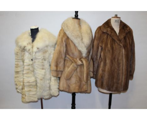 Belted blond mink jacket, a mink coat, one mink stole, one fox, others
