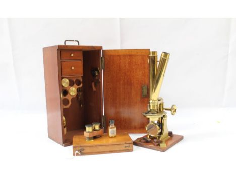 Good 19th century lacquered brass binocular microscope, probably by Ross of London, on tripod base and wooden stand, 33cm hig