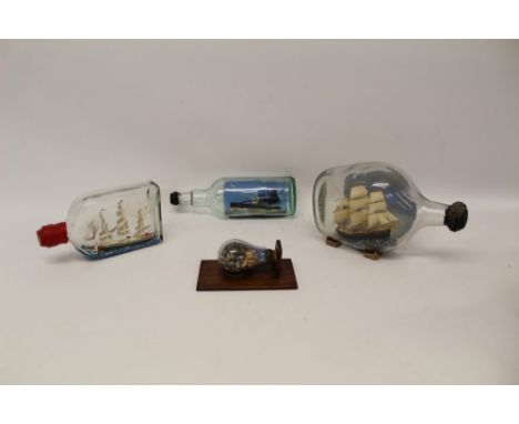 Ships in bottles to include Yarmouth steam drifter, two galleons under sail and a miniature harbour scene with lighthouse in 