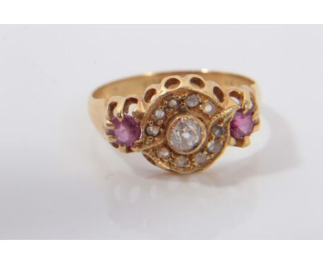 Antique gold (18ct) diamond and pink stone ring with a central old cut diamond surrounded by a border of ten rose cut diamond